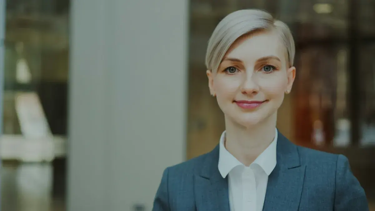 Confident business professional in a blazer in a modern office