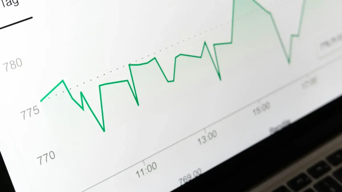 Upward trending line chart on a laptop screen
